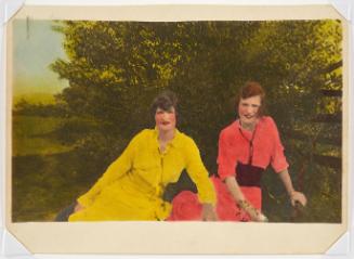 Two woman dressed in yellow and pink