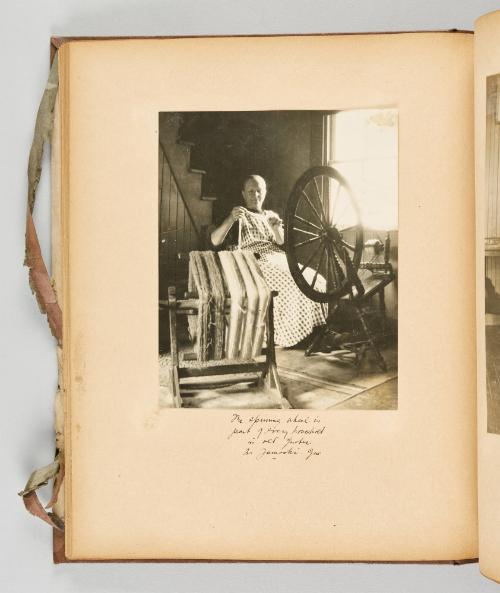 The spinning wheel is part of every household in old Quebec. In Yamoski, Que. [Page 41 of Quebec I; from collection of Canadian albums compiled by Edith S. Watson, 1890s-1930s]