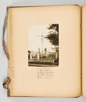A wayside "Calvaire" in Ile d'Orleans, carved by Mr. Louis Jobin. The statues have been returned to the Provincial Museum in Quebec. [Page 30 of Quebec I; from collection of Canadian albums compiled by Edith S. Watson, 1890s-1930s.]