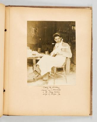 Putting the finishing touches on a crucifix in the Image makers shop in Lauzon, Que. Page 49 of Quebec II; from collection of Canadian albums compiled by Edith S. Watson, 1890s-1930s
