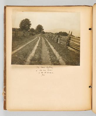 The main highway in Isle aux Coudres, in the St. Lawrence, Que. Page 40 of Quebec II; from collection of Canadian albums compiled by Edith S. Watson, 1890s-1930s
