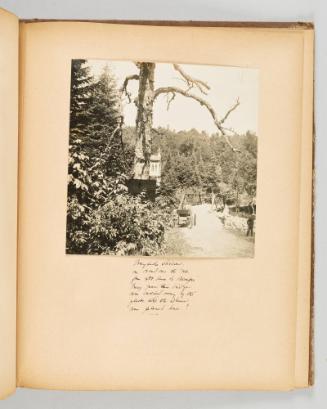 Wayside shrine, on road over the rut from Ste. Anne de Beaupre. Every year this bridge was carried away by the floods, until the shrine was placed here! Page 37 of Quebec II; from collection of Canadian albums compiled by Edith S. Watson, 1890s-1930s
