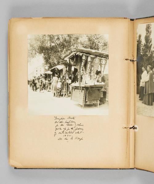 Wayside booths on the highway for the sale of relics, given up for the [illeg. Jalomy? as misspelling of and misuse of or archaic use of Jalopy?] of automobiles about 1930. Ste. Anne de Beaupré. Page 52 of Ste Anne de Beaupré; from collection of Canadian albums compiled by Edith S. Watson, 1890s-1930s
