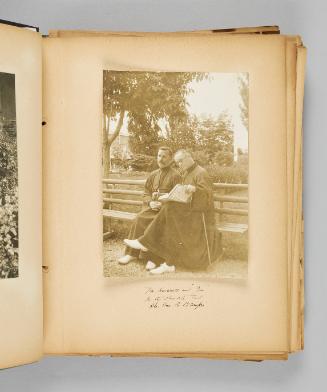 Mr Hoswell and "Joe" in the church park, Ste. Anne de Beaupré. Page 5 of Ste Anne de Beaupré; from collection of Canadian albums compiled by Edith S. Watson, 1890s-1930s