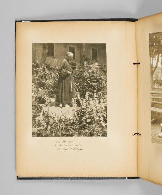 Mr. Hoswell in the convent garden. Ste. Anne de Beaupré. Page 4 of Ste Anne de Beaupré; from collection of Canadian albums compiled by Edith S. Watson, 1890s-1930s