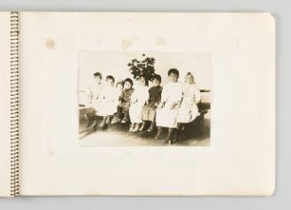 [Eight children sitting on a bench with a plant behind them], page 53 of The Doukhobors I album]