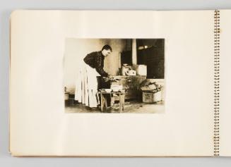 [Woman serving soup in kitchen, page 4 of The Doukhobors I album]