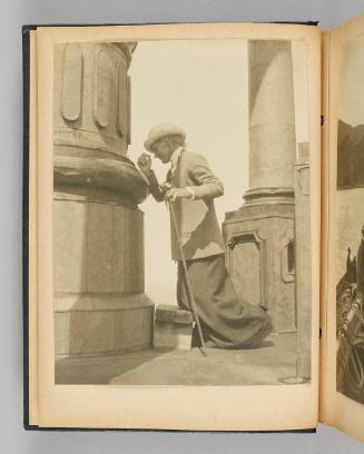 [Image of Queenie kneeling on a wooden stool at the foot of a grand column], page 8 of Happy Voyages with Queenie album]