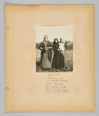 After church in Esterhazy Sask. an Hungarian settlement. Prairie congregations come from far a-field in their carts, wagons & Fords and an interesting display lined up outside of church! [Page 41 of New Canadians album]
