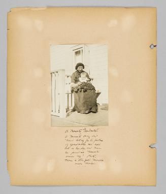 A mennonite Grandmother, a mennonite baby don't mind sitting for his picture, if grandmother will hold him in her lap and wear her familiar Mennonite black cap! Photo taken in Reinfeld Manitoba near Morden [Page 36 of New Canadians album]
