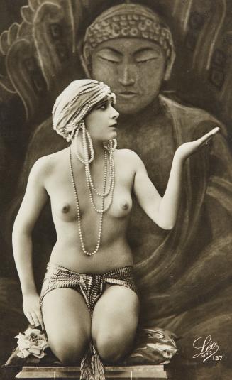 [Seated woman wearing turban and strings of pearls]