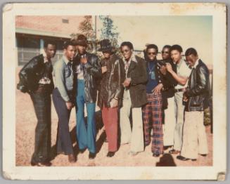 Georgia UT'S, 73 [Group of nine men pose outdoors, all wearing wide-leg pants]
