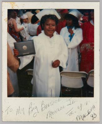 To My Big Brother Monroe Jr. From Your Marsha, '83 [Young woman in white graduation gown holding diploma]