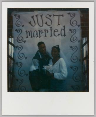 Ira Thomas / Nia Edwards, Pomona High [Bride and groom, Just Married sign]
