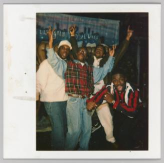 [4 men posing in front of painting; "Straight Ballin"]
