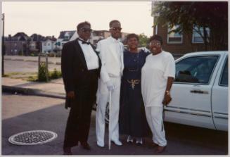 Vickie Eric Rose Peanut June 1992 [Four people standing outside beside limo, three people on left in formal wear and woman on right in white t-shirt and pants]