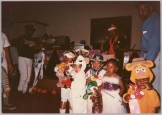 [Group of kids dressed up in Halloween costumes]
