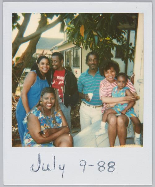 July 9, 88 [Family of six smiling while standing under tree]