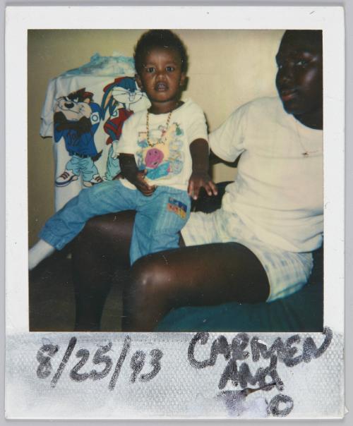 8/25/93 Carmen and [illeg.] [Little boy sitting on young women's lap]