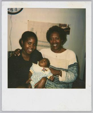 5-27-94 7 week + 1 day [Woman with arm around young woman holding a sleeping infant]
