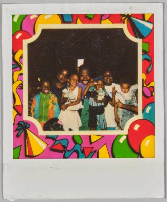 [Three adults with four children posing as group with birthday themed border]
