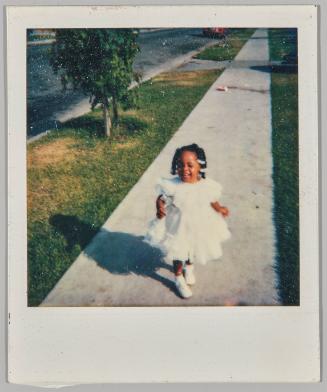 [Little girl in white dress with white clips in her hair]

