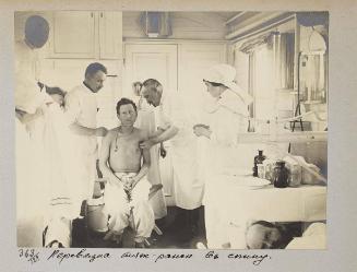 Process of bandaging of seriously wounded in the back.