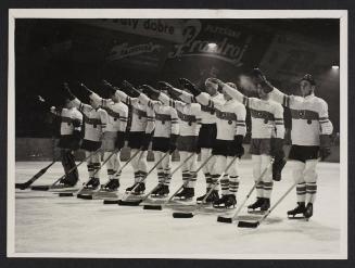 Nazi ice hockey team on the ice, saluting.
