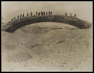 This beautiful old bridge now well behind the line, has stood all the bombardments