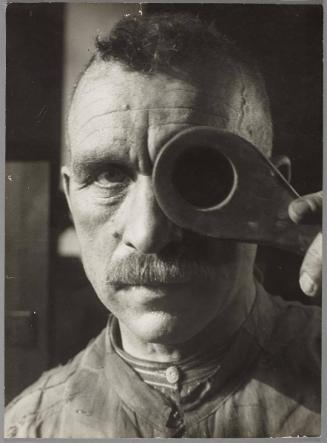 Checking the porcelain with peculiar eyeglass