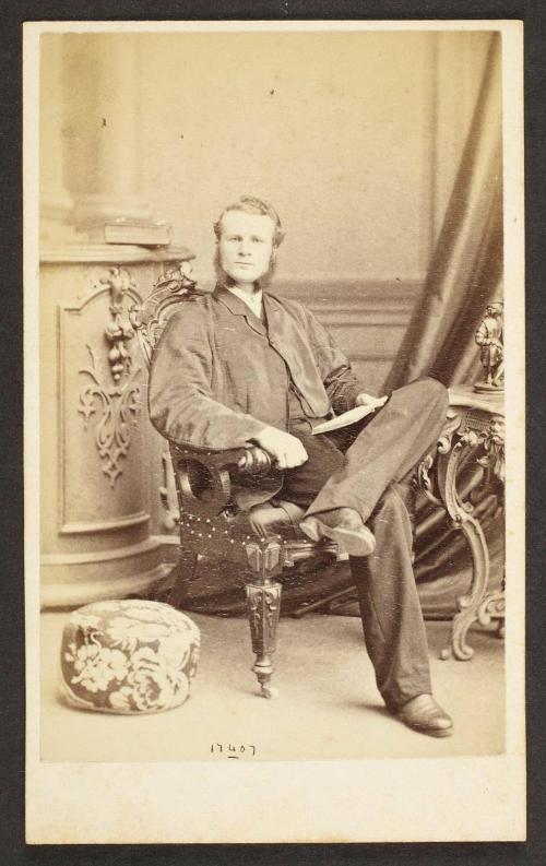 Unknown sitter [portrait of a seated man with a open book]