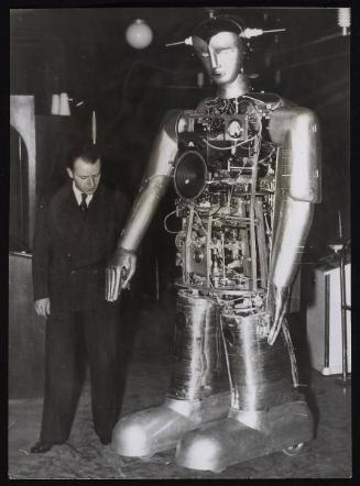 World's most lifelike robot completed after ten years. Sabor the robot undressed to show astonishing mechanism. With inventor Herr August Huber.