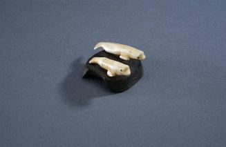 [Untitled] (Two ivory whales on stone base)