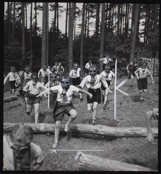 Czechoslovakia's training in National defence now starts at the age of six. Running for safety during air raid.