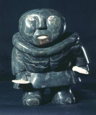 Woman Holding a Fish and an Ulu