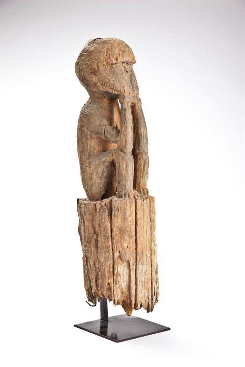 Figure (Monkey?) on a Post