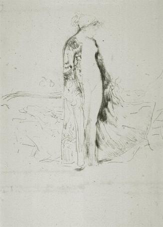 A Draped Model Standing Beside a Sofa