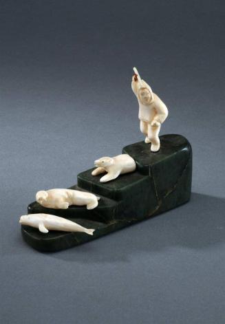 [Untitled] (Hunter on stepped base with bear, walrus and whale on lower steps)