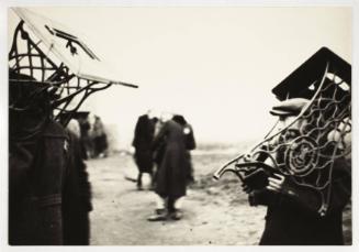 Men carrying sewing-machine tables