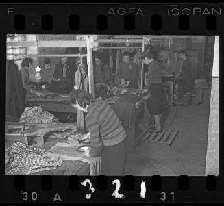 Women working in a workshop ("ressort") for textiles and garments in the ghetto