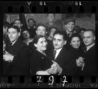 Residents dancing at a wedding reception in the ghetto