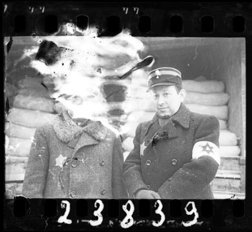 A Jewish policeman and an unidentified man with glasses