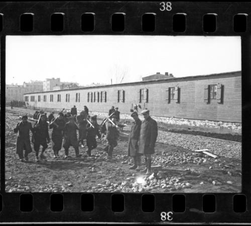 Workers carrying tools