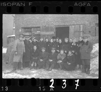 Workers of the Transport Department, outside the entrace to a stable