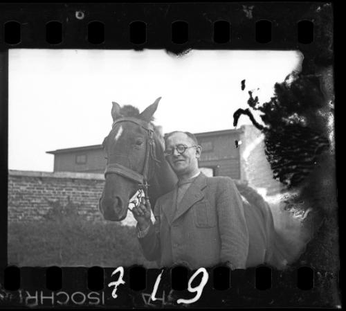 Dr. Kagan, hospital administrator, with a horse in the ghetto