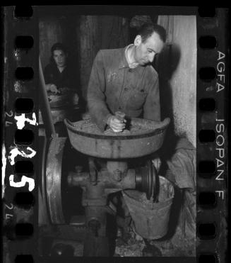 Man and a woman working in a factory