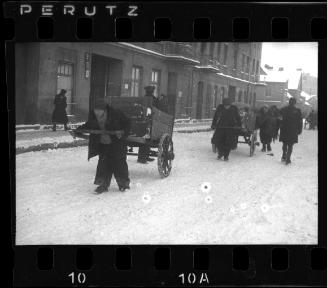 People pulling empty wagons