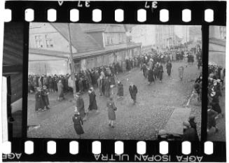 Large group of residents lined-up in the street