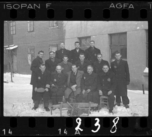 Group portrait of Jewish men in the ghetto in winter