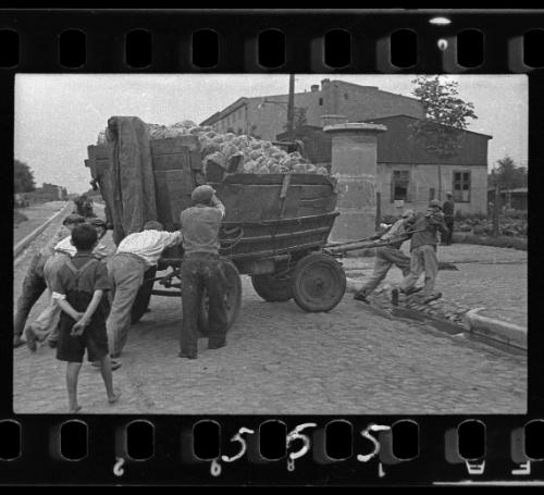Men hauling the cart for bread distribution